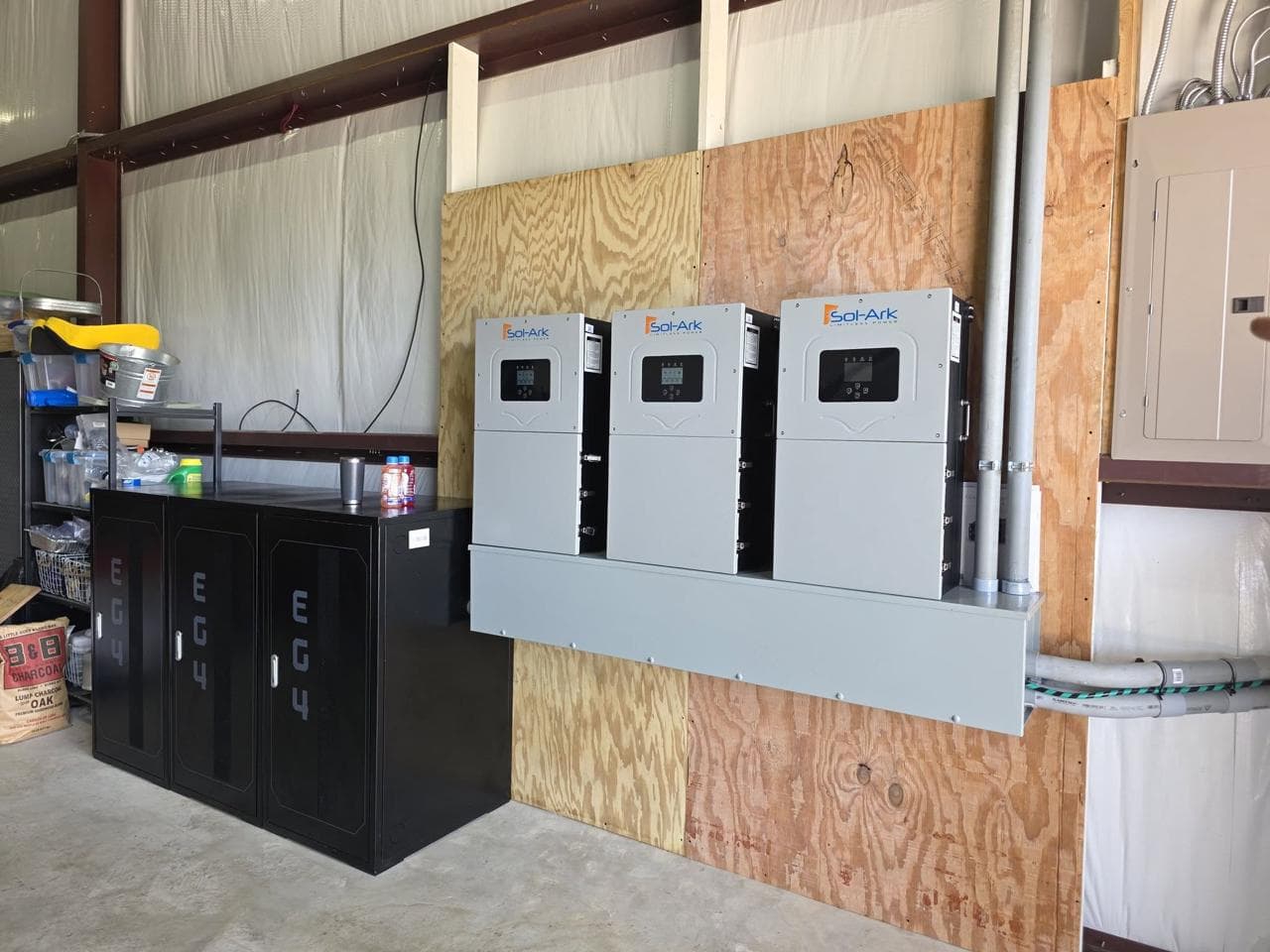 Three Sol-Ark 15k inverters and EG4 batteries mounted in a ranch shop — Schulenburg, TX